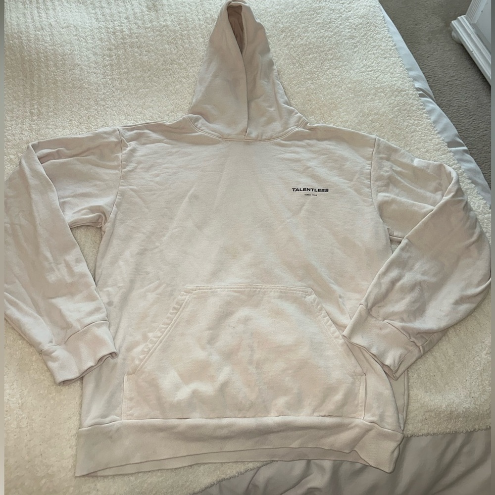 This is a Talentless sweatshirt in the color Cream. Its an XL